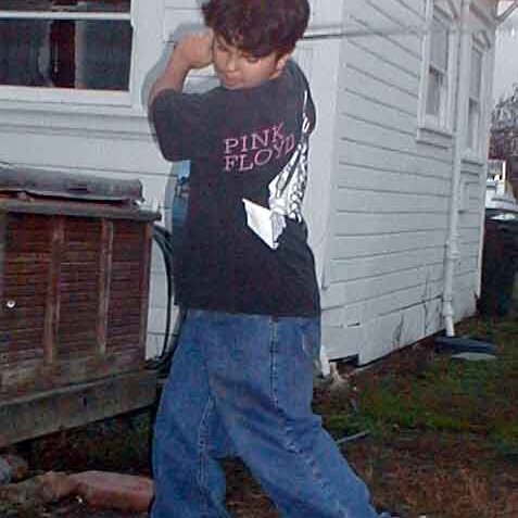 Charles_golfing Lee Webster's son Charles, trying some golf. Scanned picture, not sure of the date.