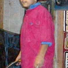 Charles_ping-pong Lee Webster's son Charles, at the ping-pong table in the shed at the Ferguson house in Mountain View CA. Scanned picture, not sure of the date.