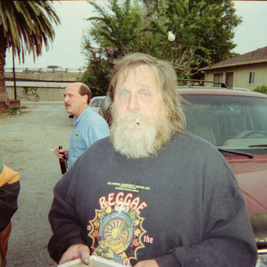 Charlie-Jackson_driveway_2_1998-12_negative A scan of the negative of Charlie Jackson in a driveway. Fernando Villasana just visable far left.