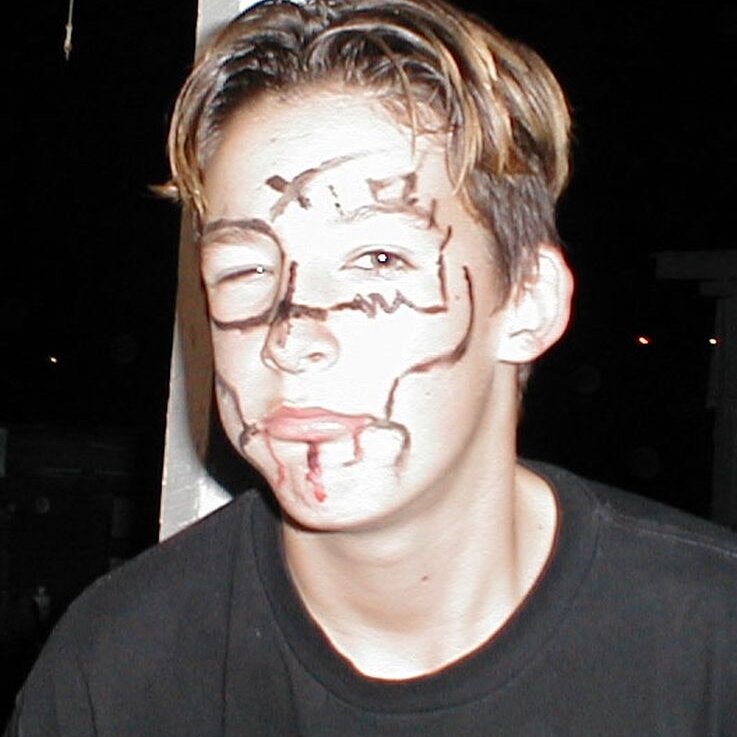 Charlie_Jackson_Halloween_1999-10-28x20-00-00 Night brings out the face paint at the pig roast at Charlie Jackson's Ferguson house in Mountain View CA, October 28th, 1999.
