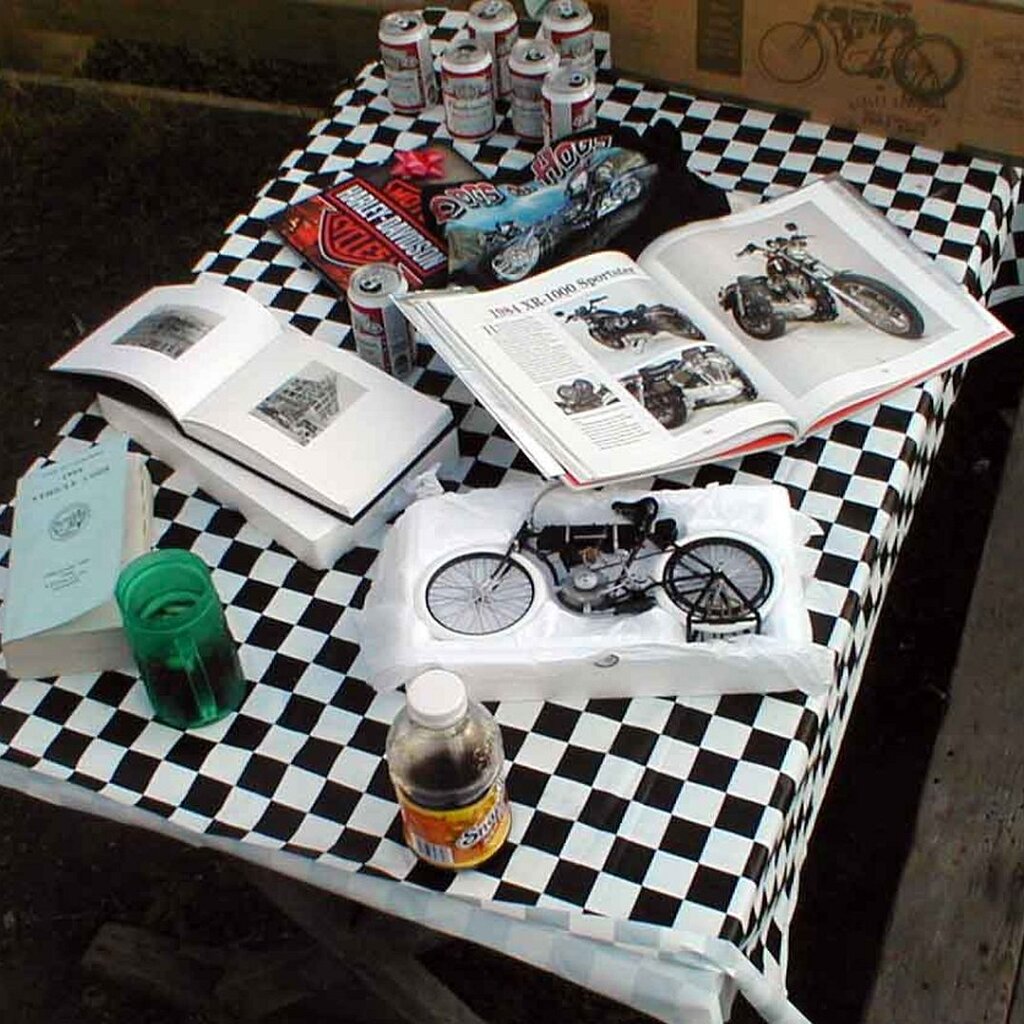 Charlie_Jackson_1999_Christmas_biker_presents What bikers get for Christmas. Note the Army field manual at the left, likely Survival, Evasion, and Escape (FM 21-76).