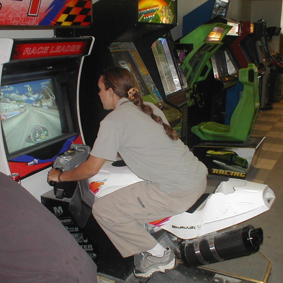 2000-07-01x13-32-02_Tracy_game Tracy at the arcade during the July 1st 2000 bike run in Hollister California.