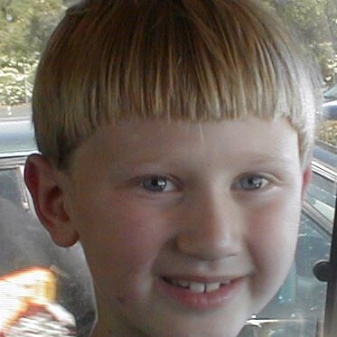 2000-06-28x10-07-12_Josh_2_at_Lee_Webster_birthday Saturday, another shot of Josh in the car. No EXIF date, so I guessed time and date.