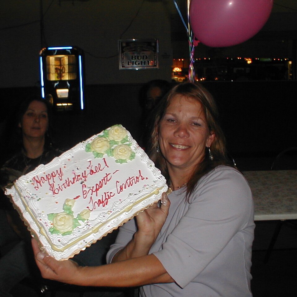 2000-07-03x17-48-34_Lee_Webster_cake Lee Webster with her cake at the Bourbon One Lounge in Sunnyvale CA. Lee worked parking at Shoreline Amphitheater, hence the cake decoration. True time and...