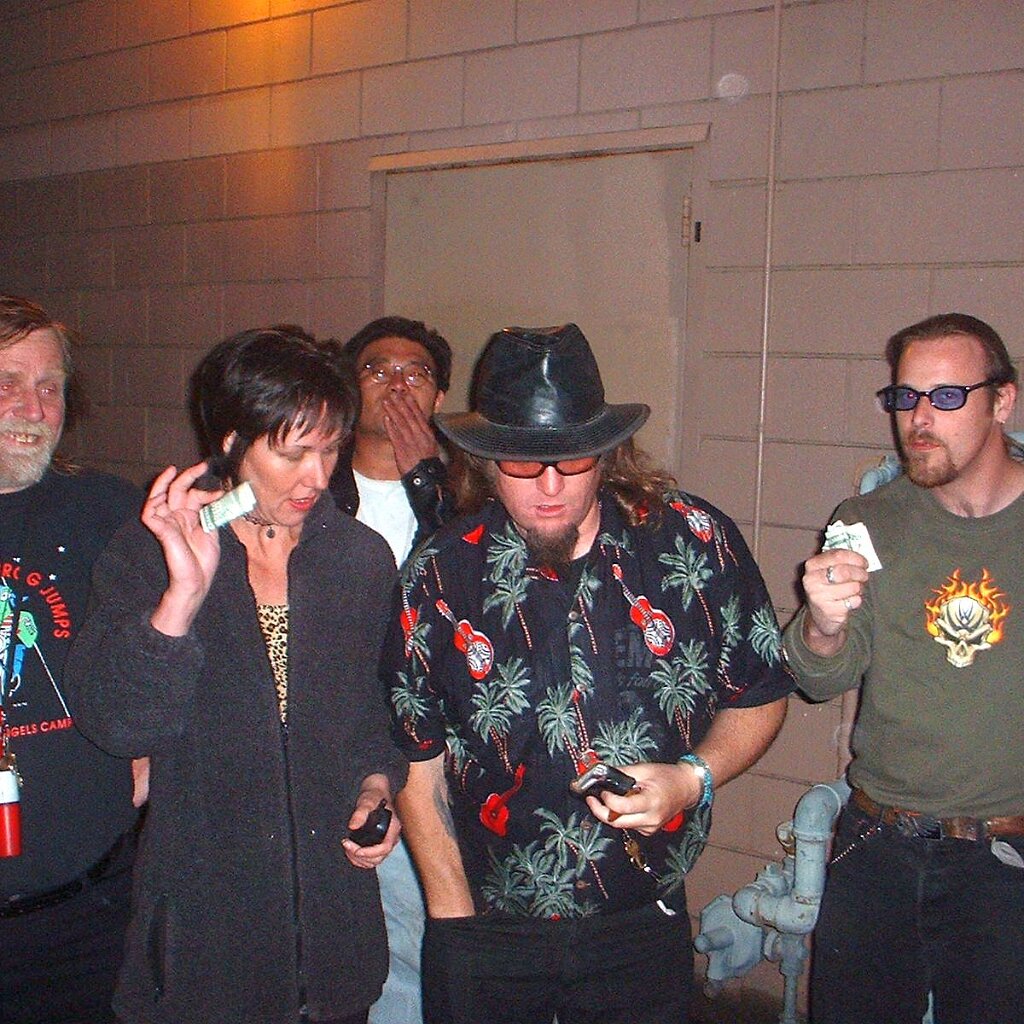 Charlie_Jackson_2002-03-17x20-08-33 Charlie Jackson, Lori Kessinger, ????, ????, and Johnny Bird, ponying up the cash behind the venue on March 17, 2002.