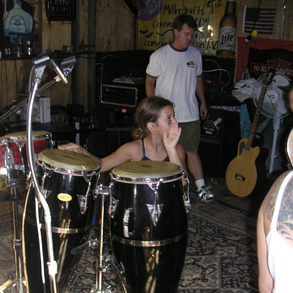 Jam_session_2004-08-08x04-12-36 Megan at the congas at Charlie Jackson's home in the barn at 12780 Clayton Road, San Jose, CA. (It's a roofer now.)