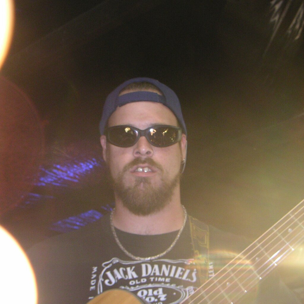 Jam_session_2004-08-08x04-46-26 Johnny Bird on the bass at Charlie Jackson's home in the barn at 12780 Clayton Road, San Jose, CA. (It's a roofer now.)