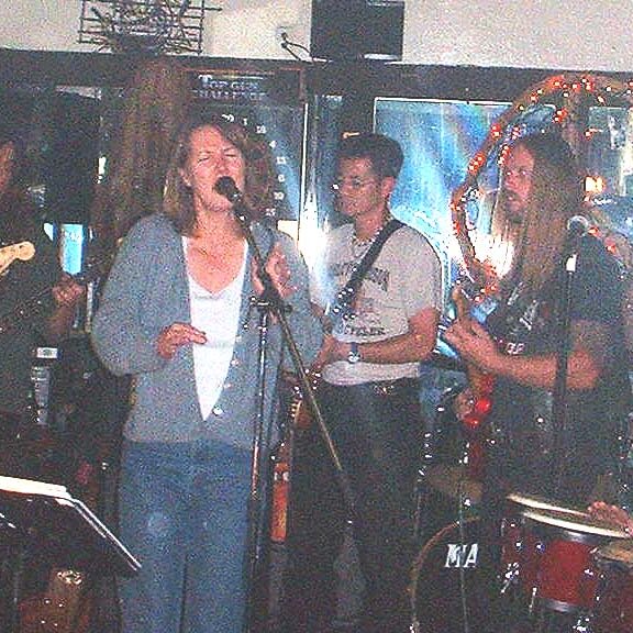 2001-10-10x22-12-01_Charlie_Jackson_drumming Lori Kessinger singing, Perry playing, Johnny Bird on guitar, and Charlie Jackson drumming way in back at Bogarts Lounge in Sunnyvale CA, October 10th,2001.